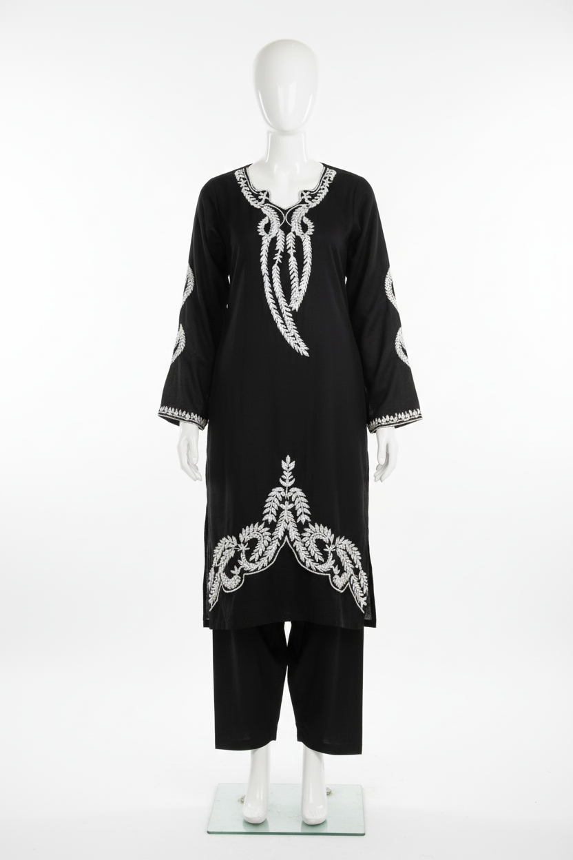 Black embroidered kameez with flowing design on mannequin