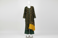 Dark green kameez suit with matching dupatta on mannequin