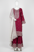 Dark pink gharara suit with silver embroidery on mannequin