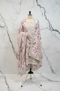 Ivory and purple floral three-piece suit with fully printed pants on marble background