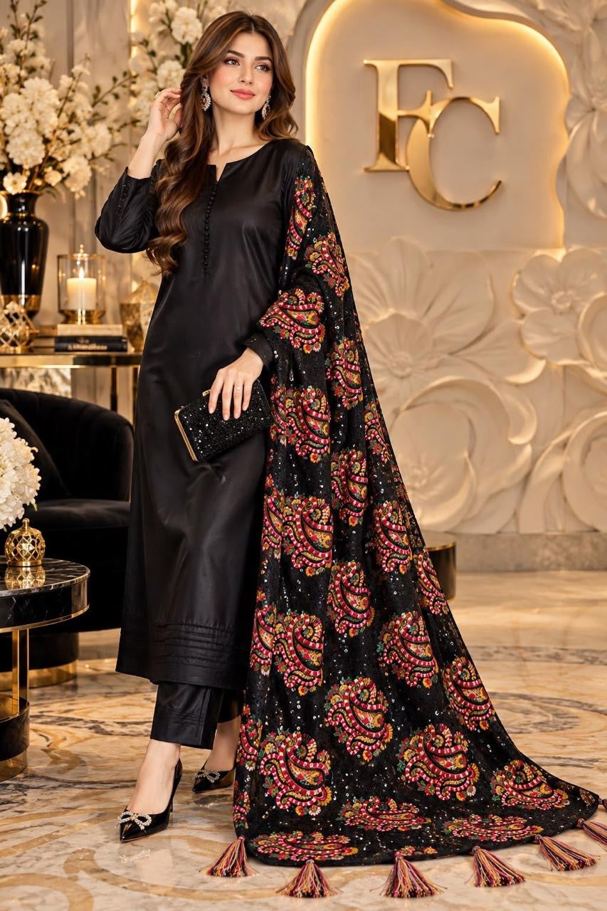 Black paisley print shawl with tassels, worn